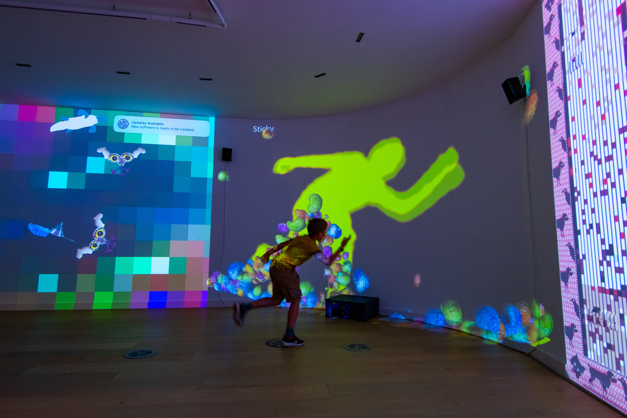 A child interacting with the exibits at the Microworlds Exhibition