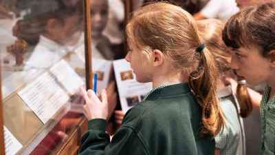 Pre-History: From Stone Age to Iron Age Pupils studying pre-historic artefacts