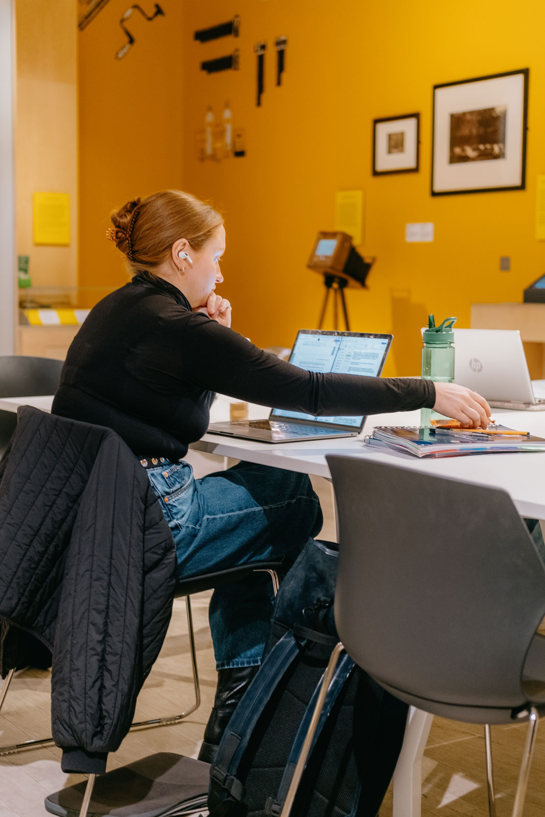 Library user working with laptop