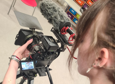 Young Photographer using a camera