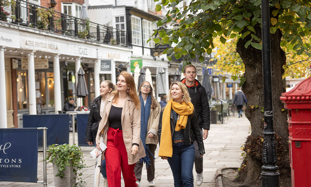 People on a Group walking tour through the Pantiles.